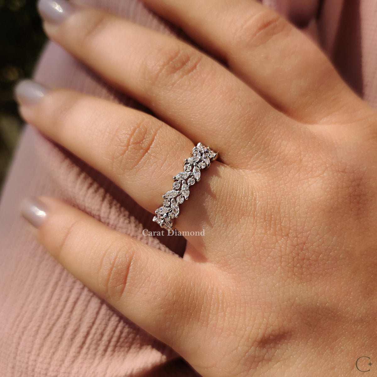 Custom wedding band with marquise and round diamonds.