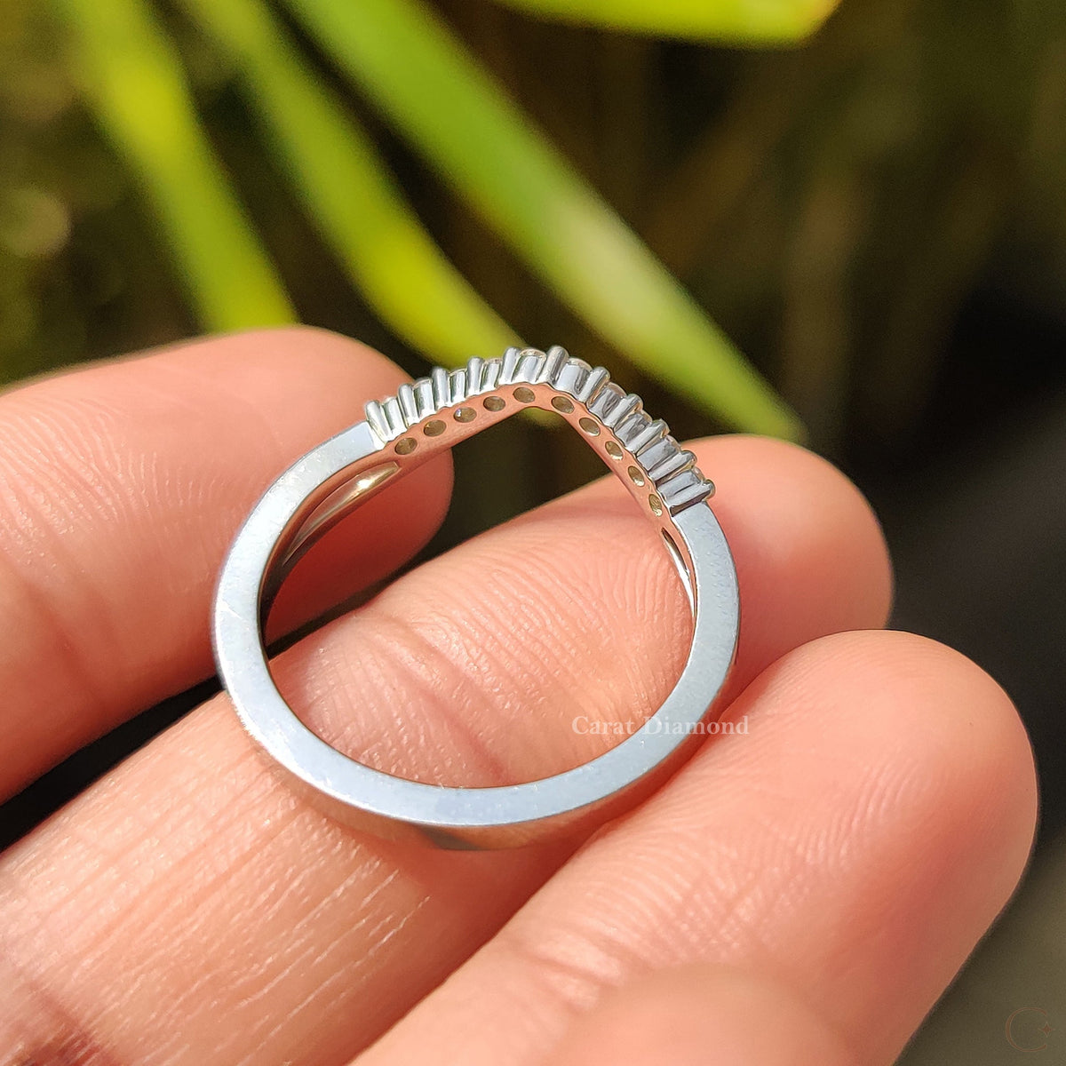 Handmade curved wedding band with lab-grown diamonds.