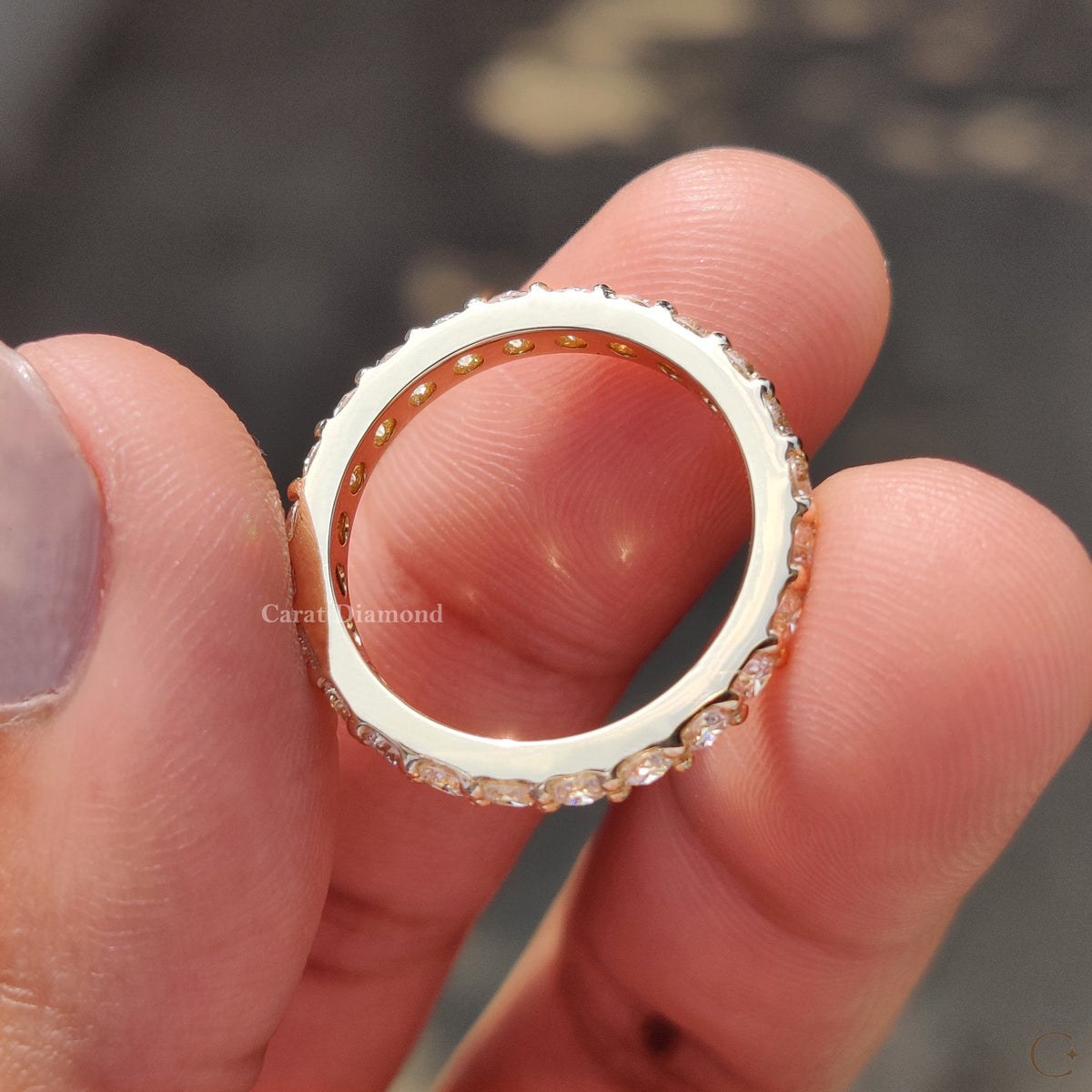 Handmade band presented on a smooth ceramic tray.