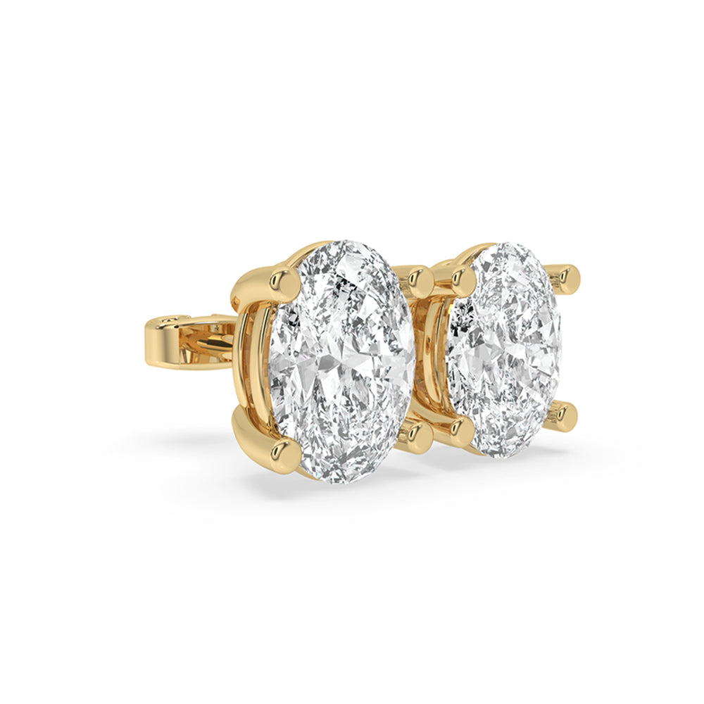 Diamond earrings oval design with yellow gold diamond accents for a sophisticated look.