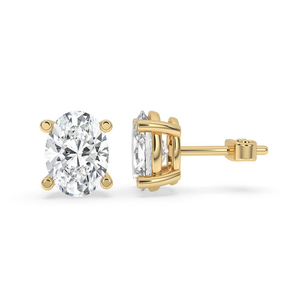 Gold oval earrings featuring a stunning 4 prong setting for timeless style.