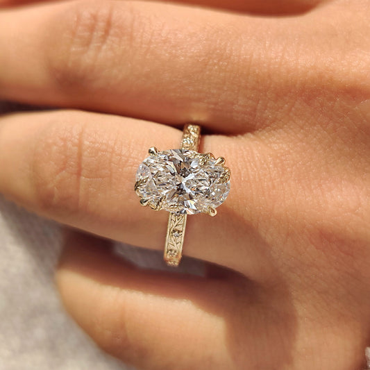 Oval center diamond ring with vintage style tulip setting