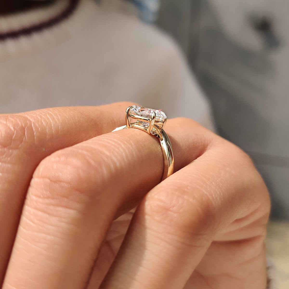 Oval cut diamond ring crafted with four claw prong setting