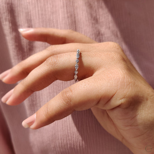Diamond wedding band marquise style with beautiful round diamonds.