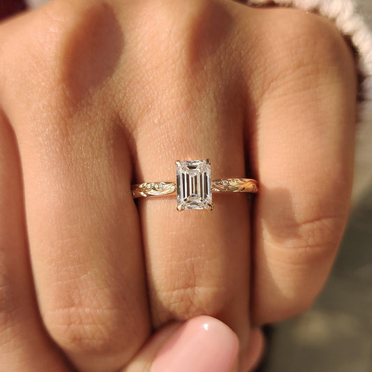 Tulip basket engagement ring with emerald cut diamond.