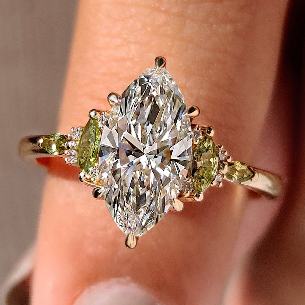 Marquise diamond ring with marquise and round side stone design.