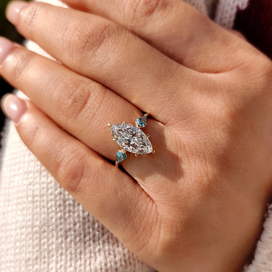 Tapered shank ring with marquise cut diamond.