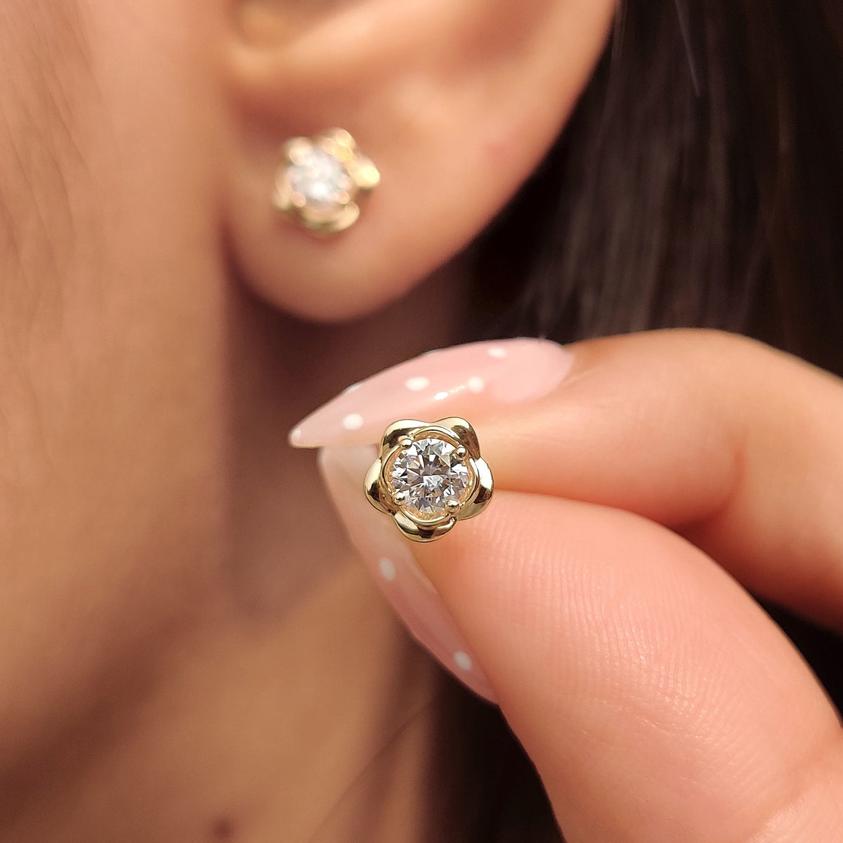 Handmade diamond flower stud earrings.