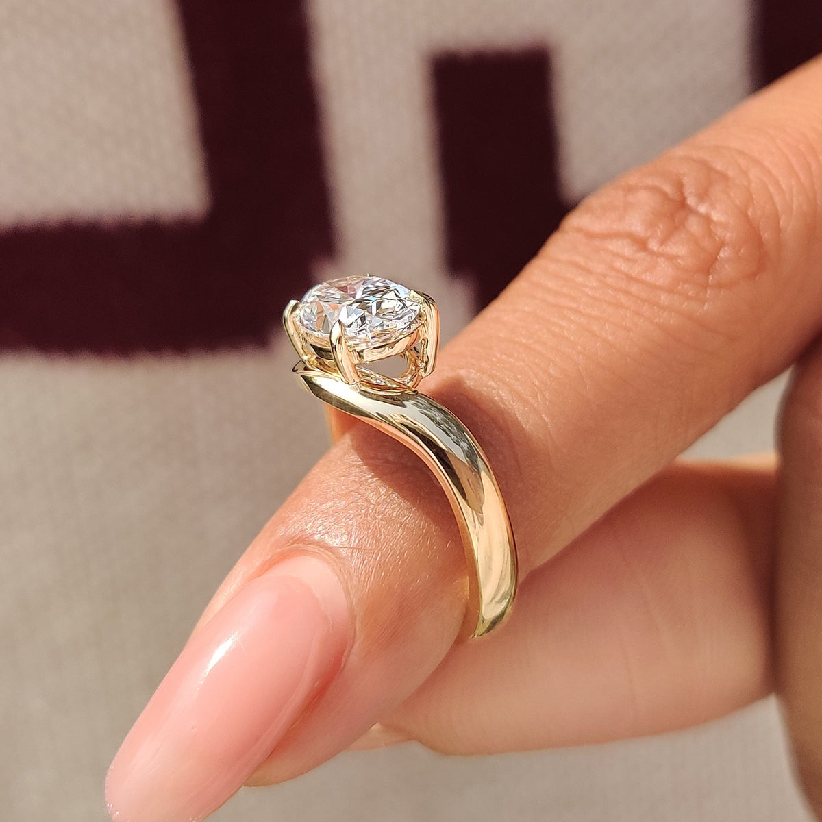 Oval cut diamond ring featuring lab grown diamond center