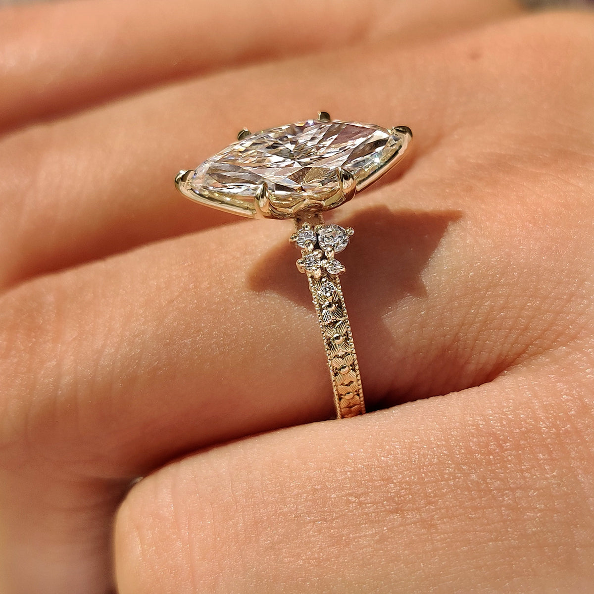 Vintage marquise ring with round diamond side stones