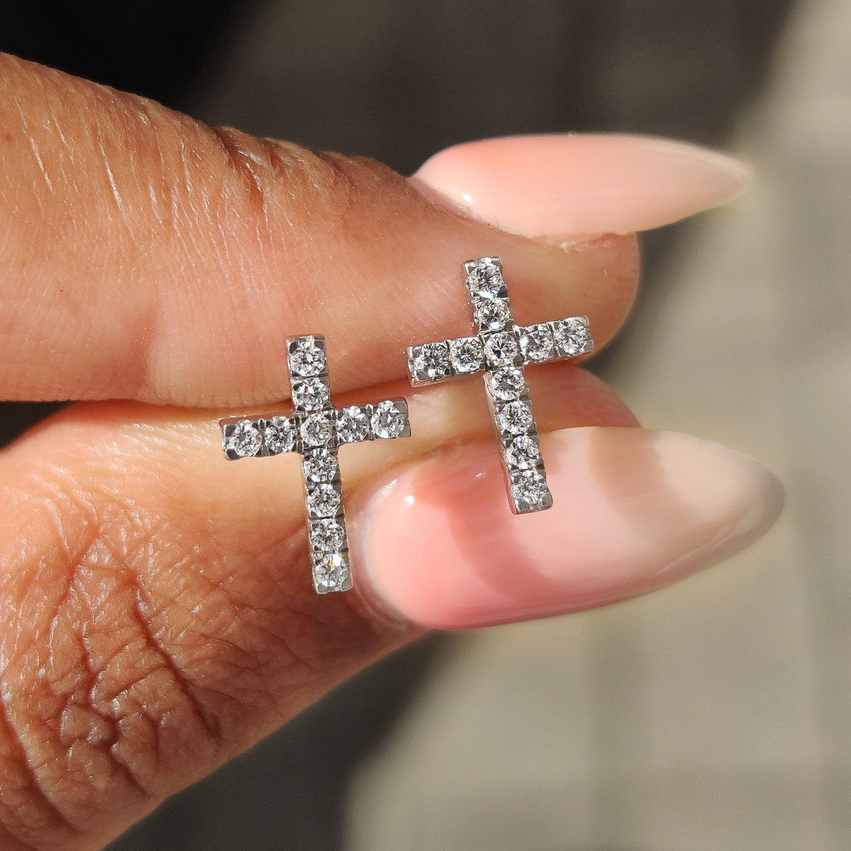 Diamond Cross Earrings in white gold with round cut diamonds.