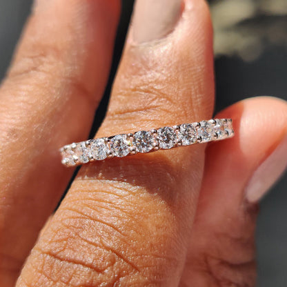 Round eternity band featuring brilliant diamonds around the band.