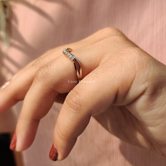 Round cut diamond wedding band with a curved fit.