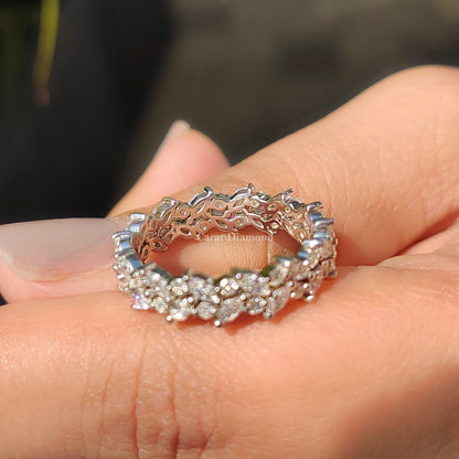 Marquise and round diamond band in a prong setting.