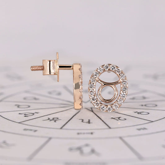 Custom Taurus zodiac earrings in rose gold with halo diamonds.