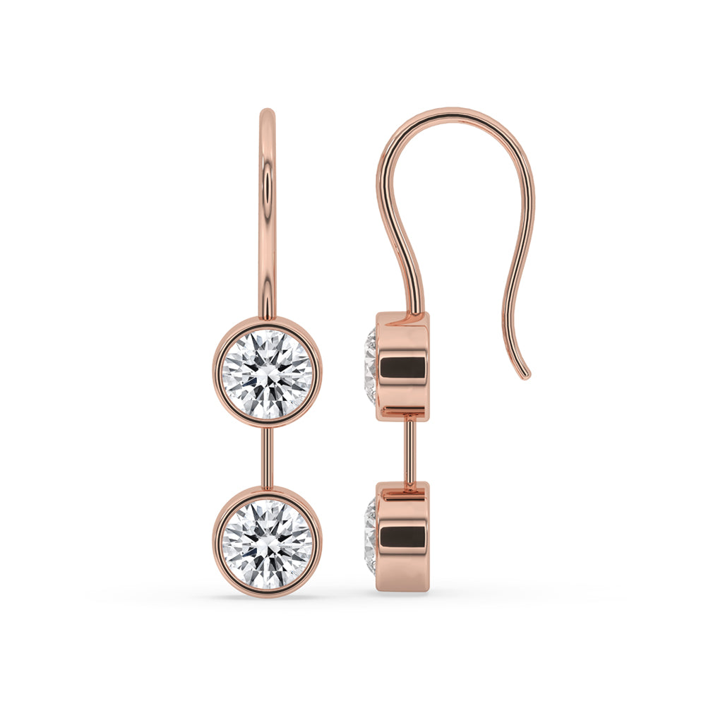 Gold dangle earrings featuring round diamond earrings for a sophisticated look.