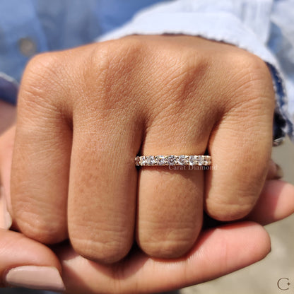 Diamond Wedding Band resting beside a bridal bouquet.