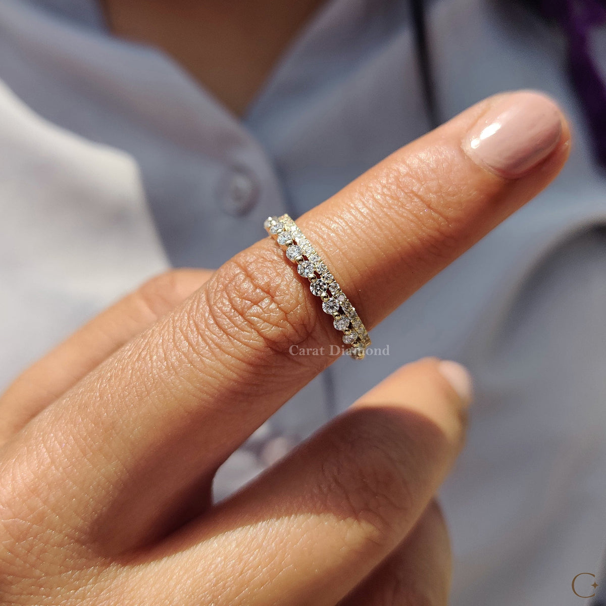 Carat Diamonds Wedding Band highlighted in soft lighting.