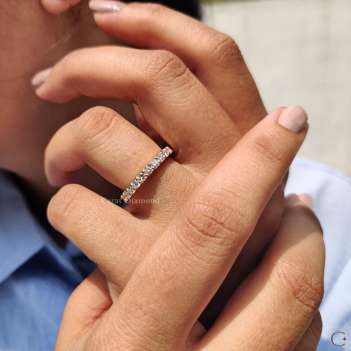 Full Eternity Wedding Band shown in a circular display case.