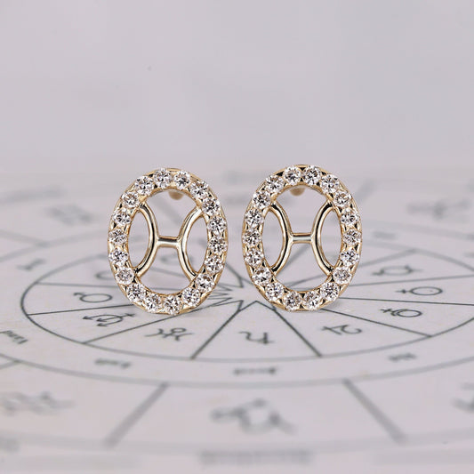 Pisces earrings in yellow gold with halo diamond studs.