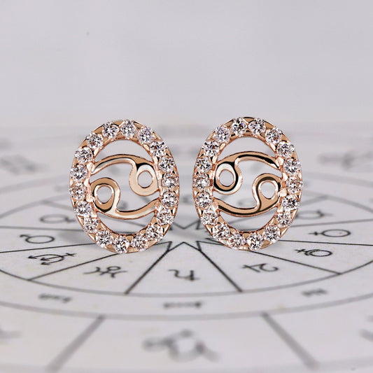 Cancer earrings in rose gold with round cut halo diamonds.