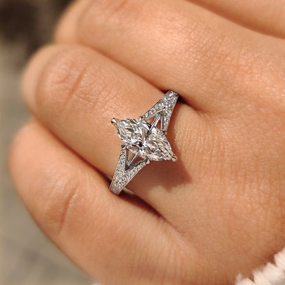 Marquise solitaire diamond ring with tulip prong setting style.