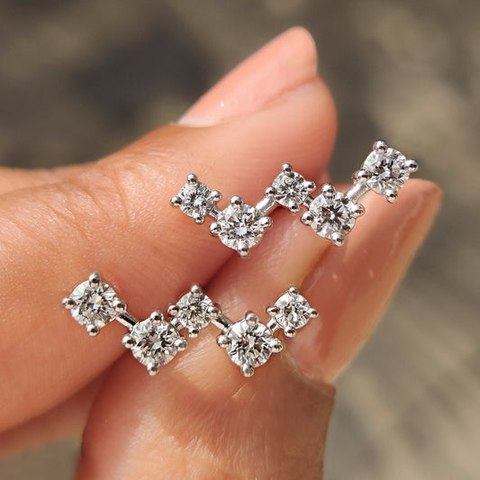 Round diamond stud earrings with white gold setting and screw back design