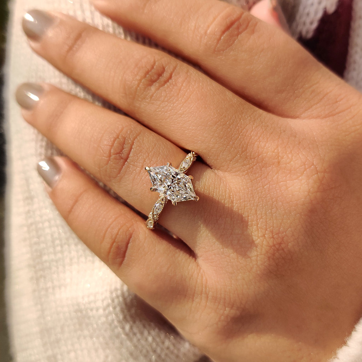 Marquise and round side stone ring in a vintage style.