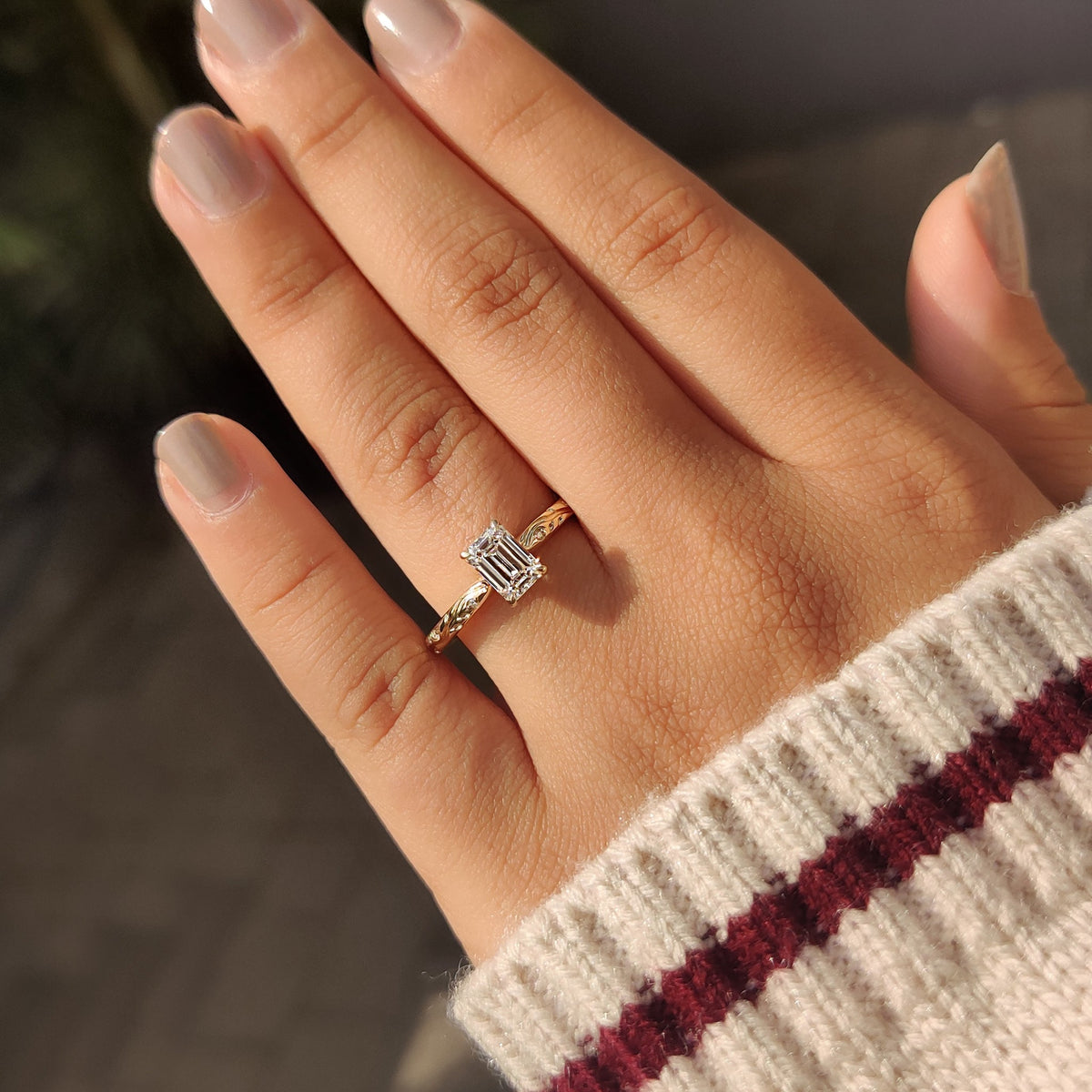 Yellow gold ring with round side diamonds.