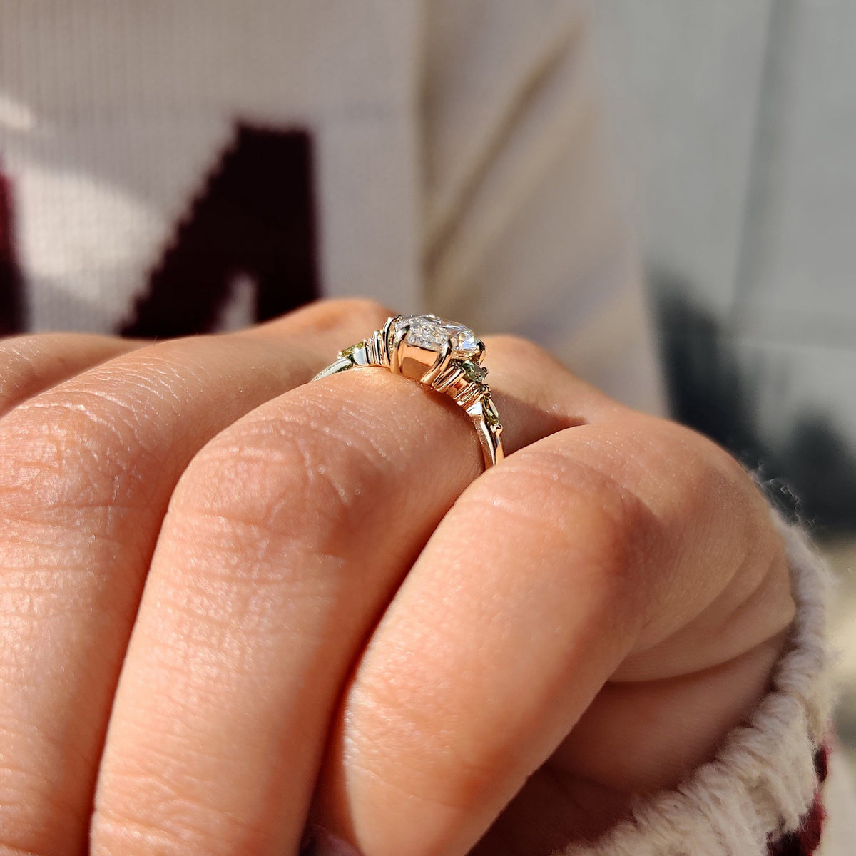 Marquise and round side stone ring with tapered shank style.