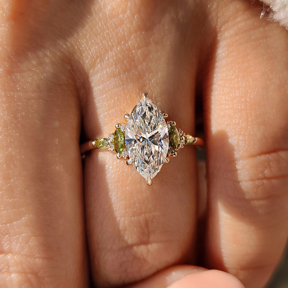 Handmade marquise diamond ring with muse setting detail.