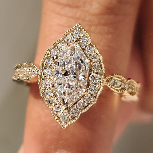 Dutch marquise diamond engagement ring with halo style.