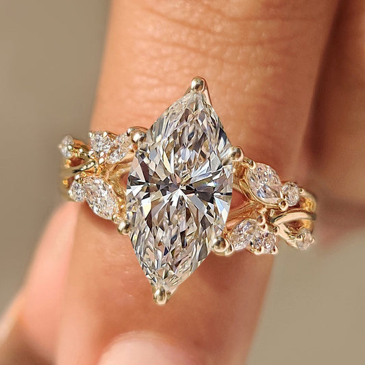 Nature inspired engagement ring with marquise diamond tulip setting.