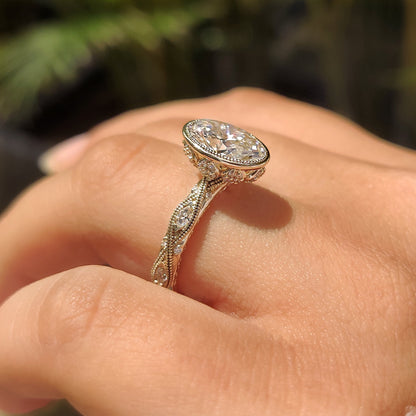 Bezel ring with marquise and round side stones