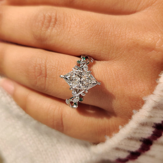 Nature inspired diamond ring with marquise side stone details
