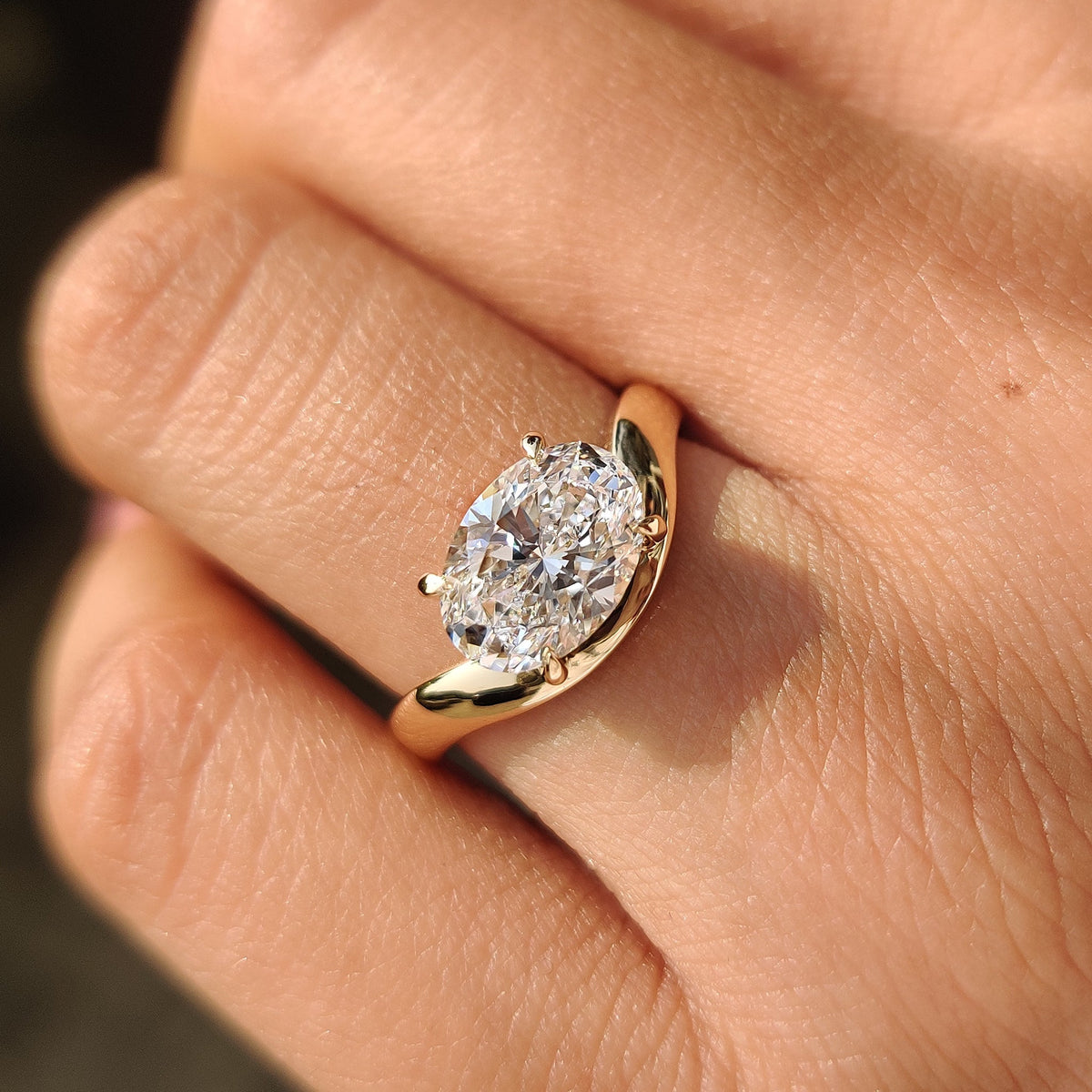 Oval cut diamond ring in solitaire style design
