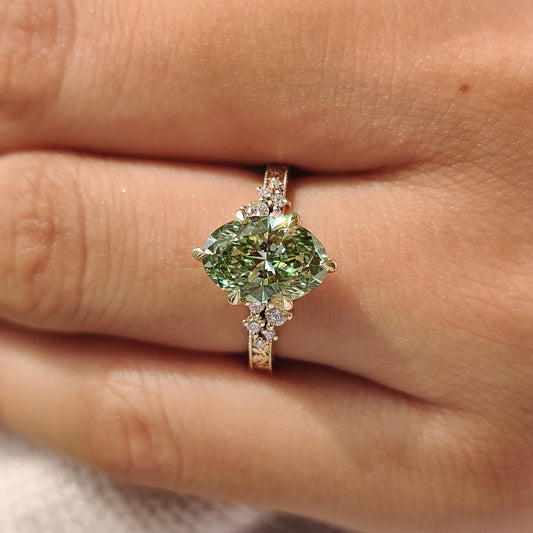 Vintage inspired green oval engagement ring