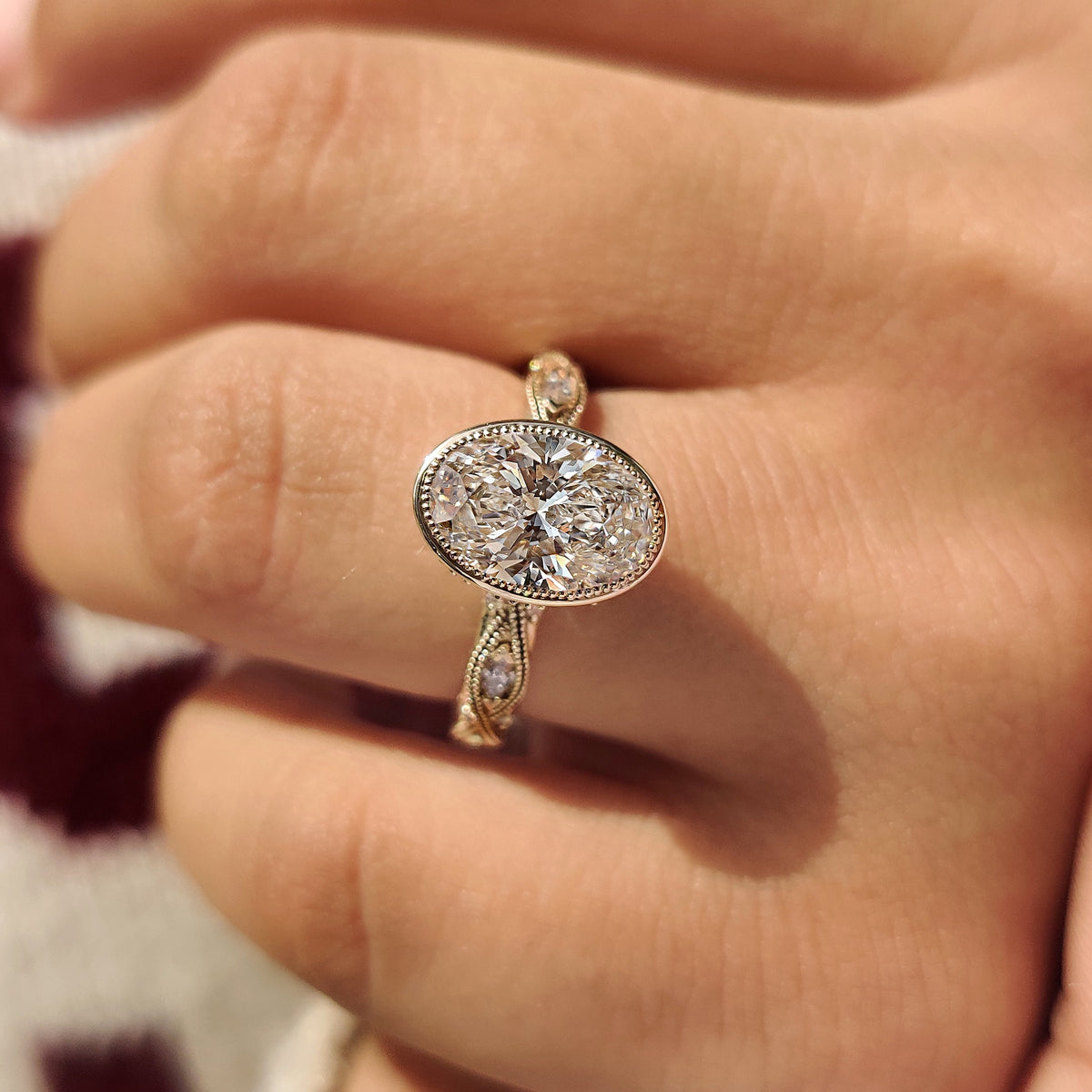 Oval bezel set ring with milgrain details