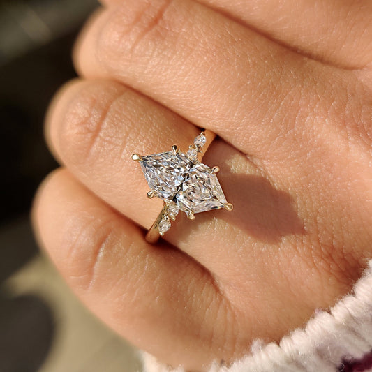 Handmade marquise ring with round bridge accent design.
