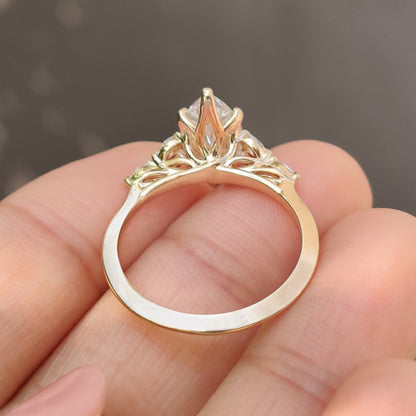 Marquise diamond ring with muse setting and side stones