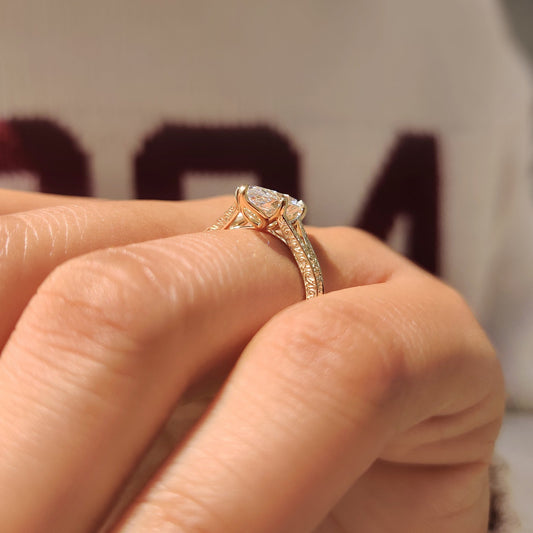 Vintage diamond ring featuring filigree details and split shank band