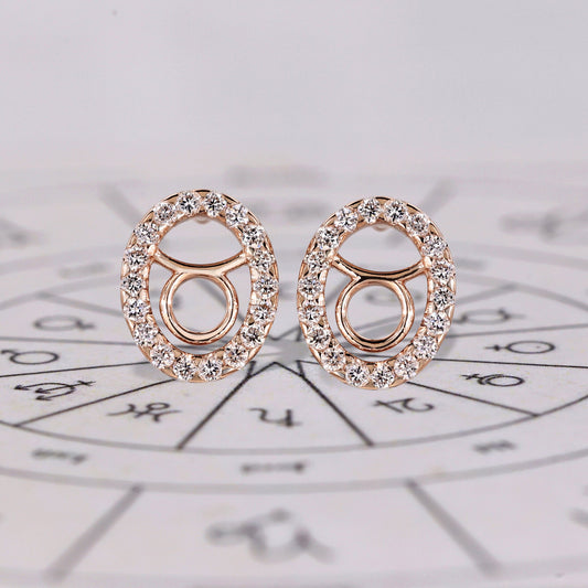 Taurus earrings in rose gold with round diamond halo studs.